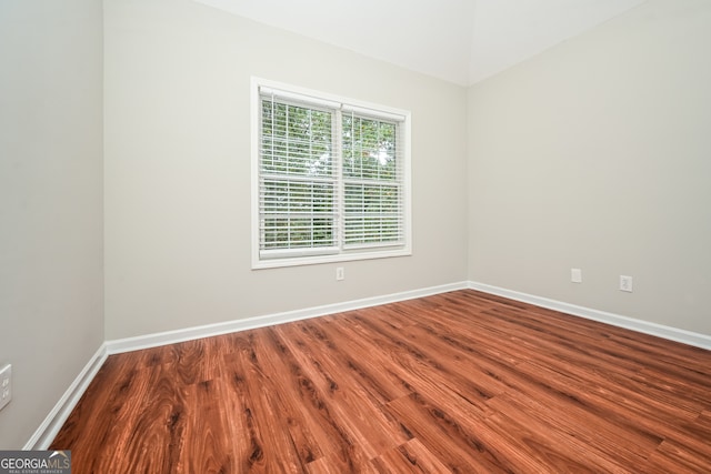 spare room with hardwood / wood-style floors