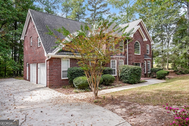 front of property with a garage