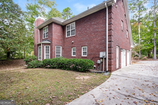 view of side of home with a garage