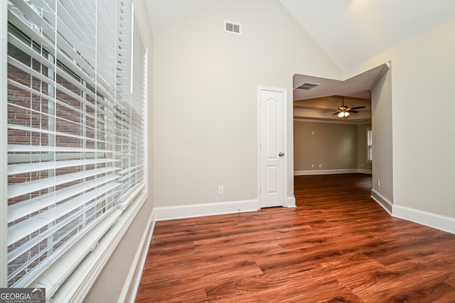 spare room with hardwood / wood-style flooring, ceiling fan, and vaulted ceiling