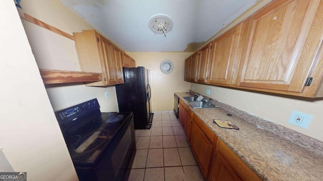 kitchen featuring black appliances, light stone countertops, light tile patterned floors, and sink