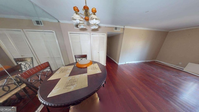 dining space with a notable chandelier, crown molding, and dark wood-type flooring