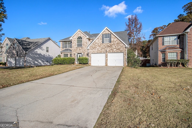 view of front property with a front yard and a garage