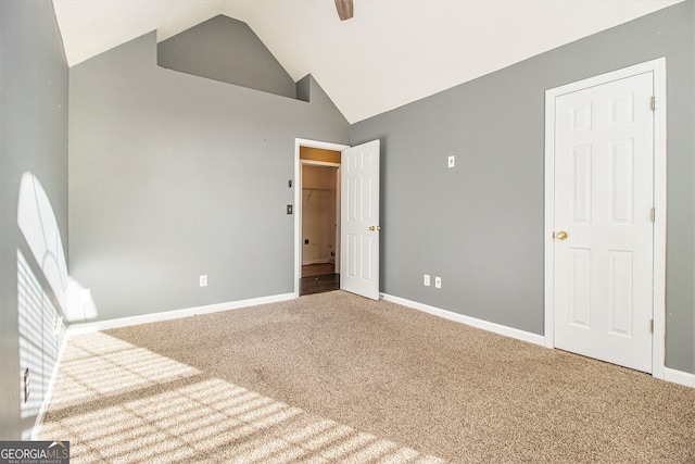 interior space with ceiling fan, carpet floors, and high vaulted ceiling