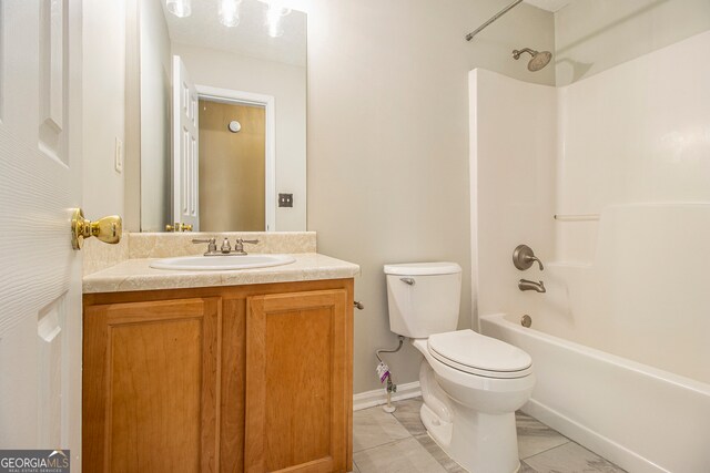 full bathroom with bathtub / shower combination, vanity, and toilet