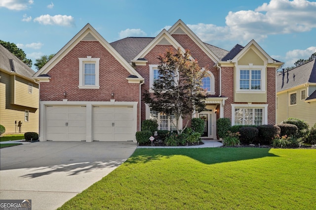 view of front of property featuring a front lawn and a garage