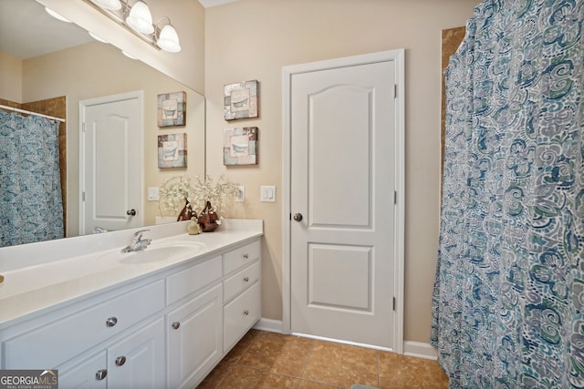 bathroom with tile patterned flooring, vanity, and a shower with shower curtain