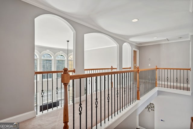 corridor featuring carpet floors and crown molding