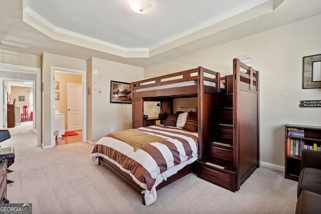 carpeted bedroom featuring a raised ceiling and crown molding