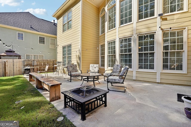 view of patio / terrace featuring an outdoor fire pit