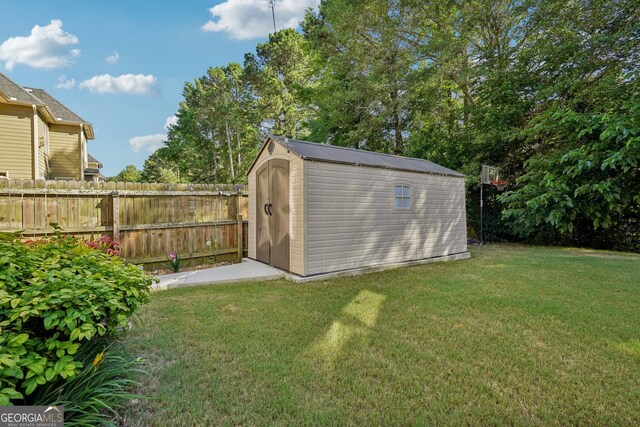 view of outbuilding with a lawn