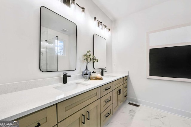 bathroom with vanity and a shower with door