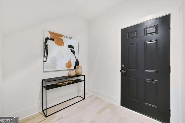 foyer entrance with light wood-type flooring