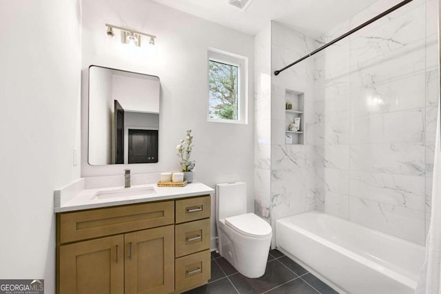 full bathroom featuring tile patterned flooring, vanity, toilet, and shower / tub combo