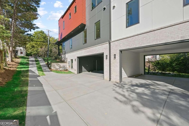 view of side of property with a garage