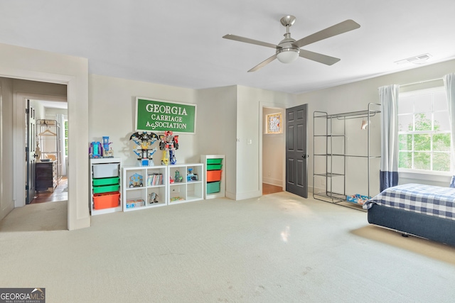 bedroom with ceiling fan and carpet