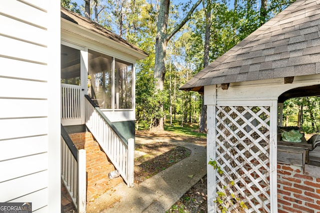 view of yard with a sunroom