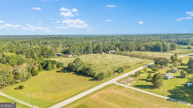 birds eye view of property featuring a rural view