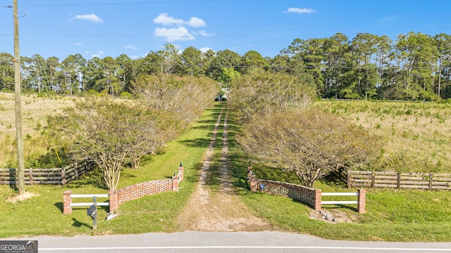 birds eye view of property featuring a rural view