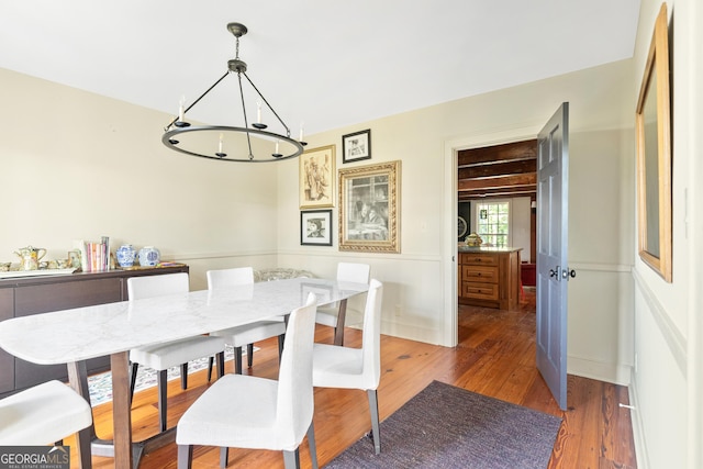 dining space featuring dark wood-type flooring