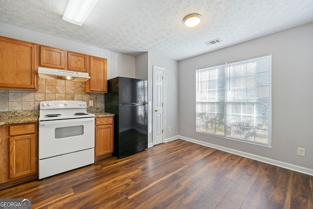 kitchen featuring black fridge, white range with electric cooktop, and dark wood-type flooring