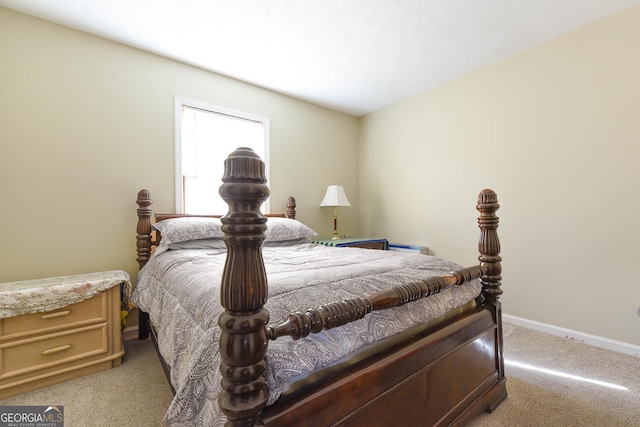 carpeted bedroom with baseboards