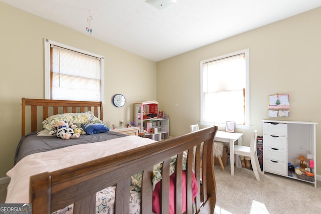 bedroom with light colored carpet