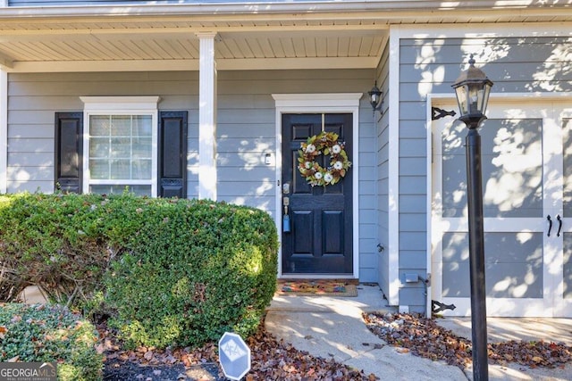 property entrance with covered porch