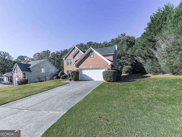 view of front of property with a front yard and a garage