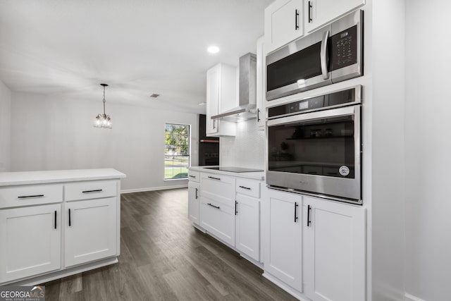 kitchen with white cabinets and appliances with stainless steel finishes