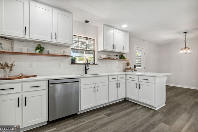 kitchen with hanging light fixtures, dishwasher, a healthy amount of sunlight, and sink