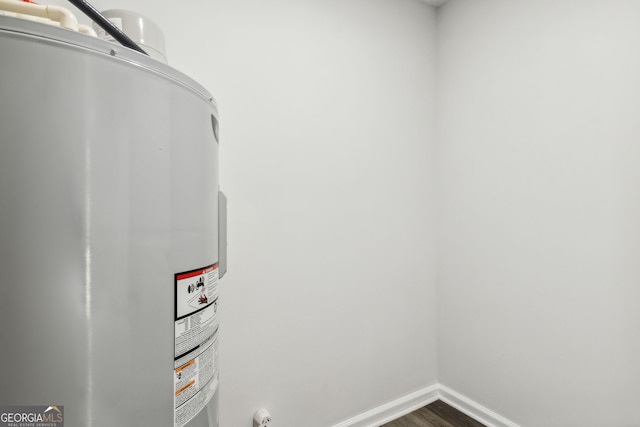 interior space featuring wood-type flooring and electric water heater