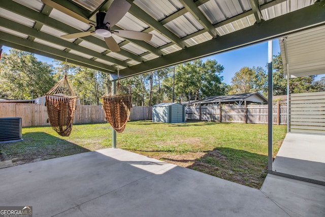 view of patio / terrace featuring ceiling fan, central AC unit, and a shed