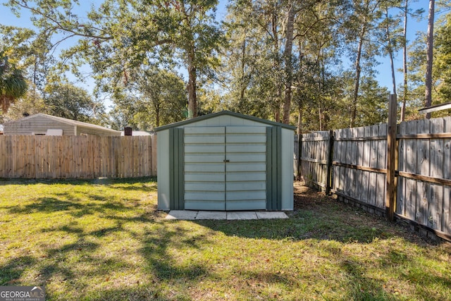 view of outbuilding with a yard