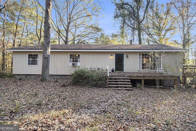 ranch-style house featuring cooling unit