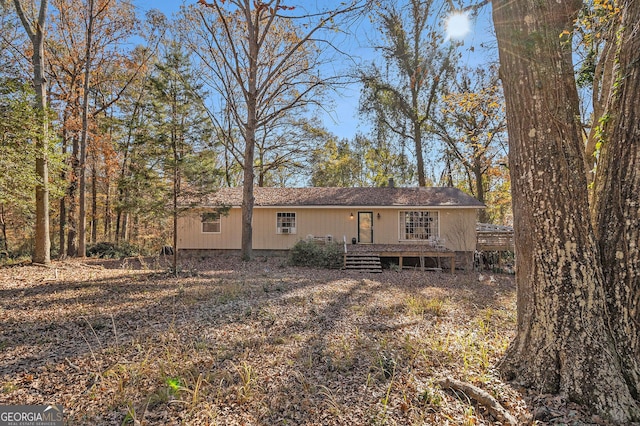 back of property with a deck