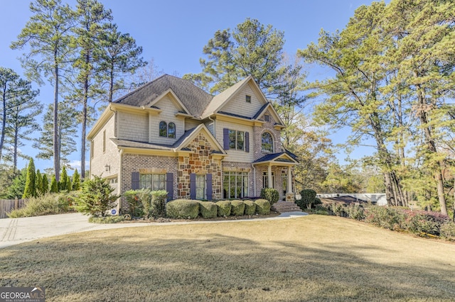 craftsman-style home with a front lawn