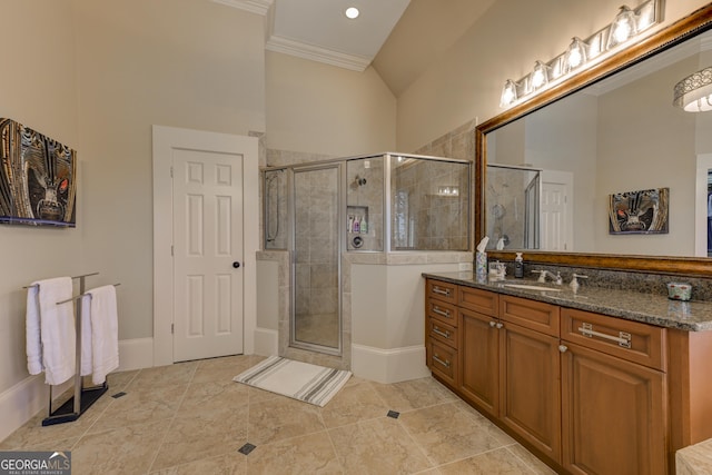 bathroom with vanity, tile patterned floors, an enclosed shower, and ornamental molding