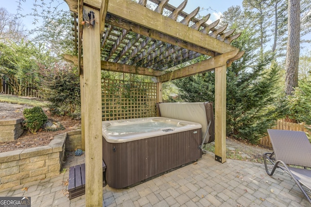 view of patio / terrace with a pergola and a hot tub