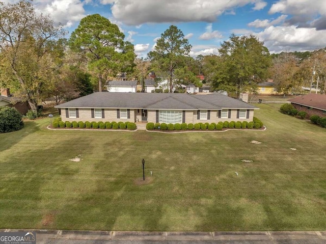 view of front of home with a front lawn