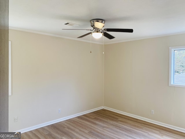 empty room featuring light hardwood / wood-style floors, ceiling fan, and ornamental molding