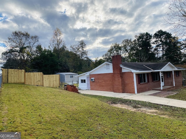 view of property exterior featuring a lawn