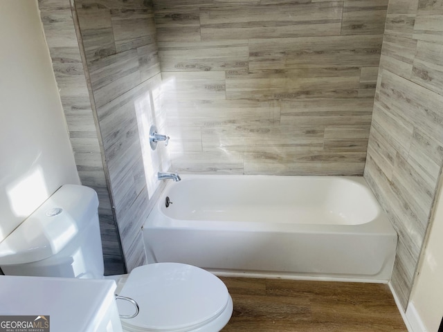 bathroom featuring vanity, hardwood / wood-style flooring, and toilet