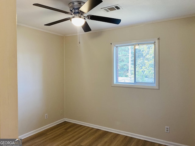 spare room featuring wood-type flooring, ceiling fan, and ornamental molding