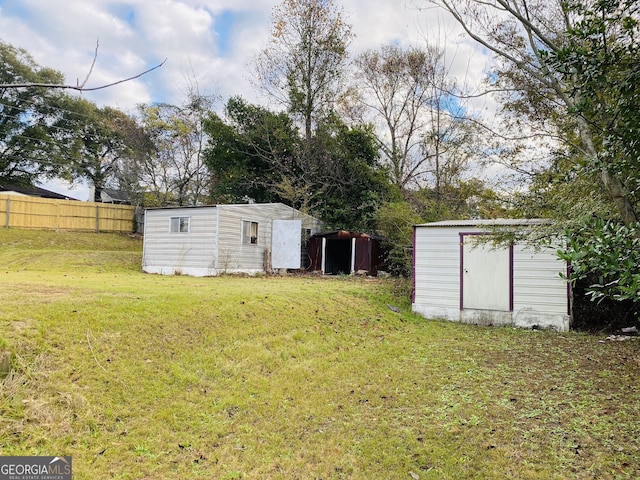 view of yard with a storage unit