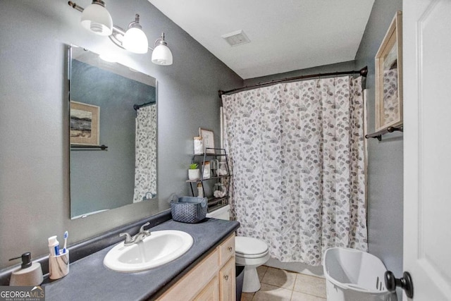 bathroom featuring tile patterned flooring, vanity, toilet, and a shower with shower curtain