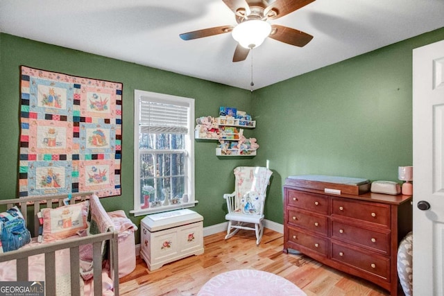 bedroom featuring ceiling fan and light hardwood / wood-style floors