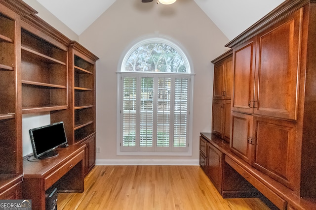 unfurnished room featuring ceiling fan, light wood-type flooring, crown molding, and a tray ceiling