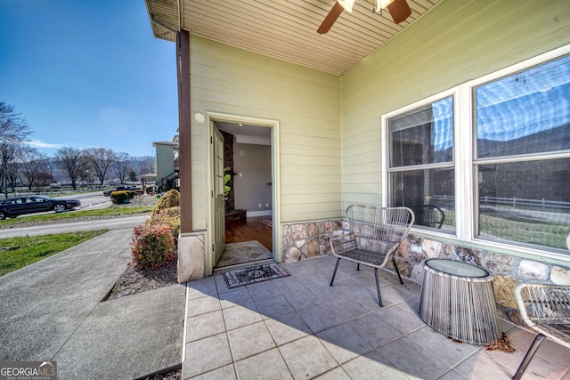 view of patio / terrace featuring ceiling fan