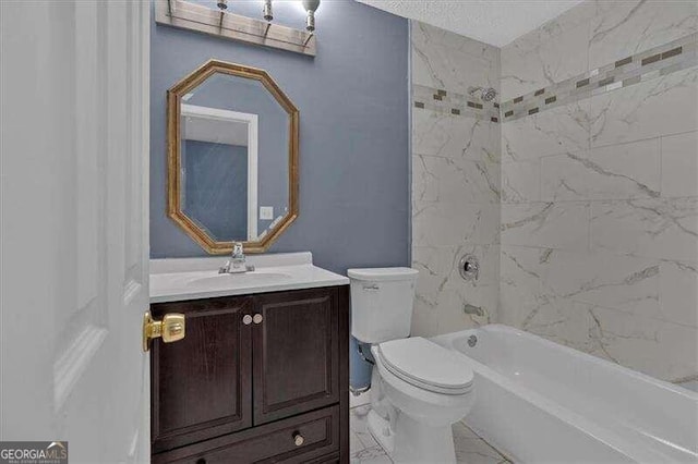 full bathroom with vanity, tiled shower / bath combo, and toilet